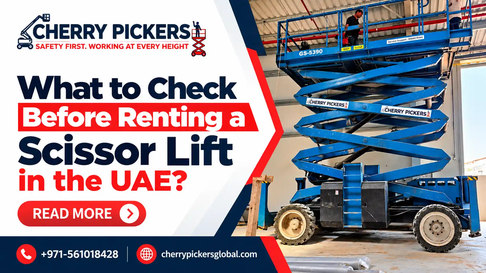 Blue scissor lift raised for maintenance work inside an industrial warehouse in the UAE